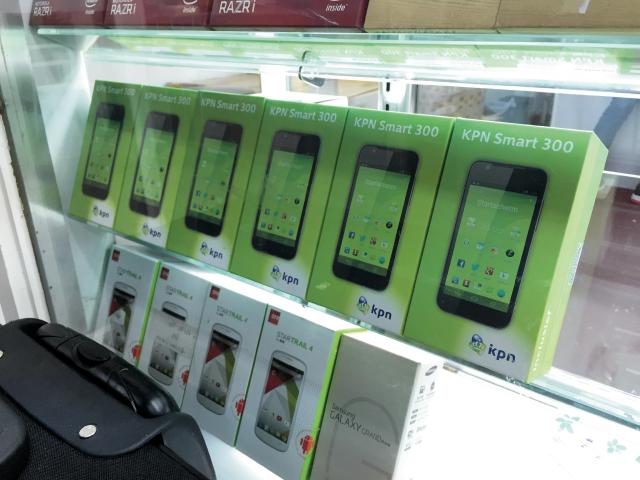 14-day phones on sale at the ground floor stalls in Chunkin Mansions. KPN is a Dutch telecoms company. These are white-label phones designed and made in mainland China, marketed in the Netherlands, returned by Dutch customers, shipped back to Hong Kong and finally to be sold to South-East Asian or African traders.