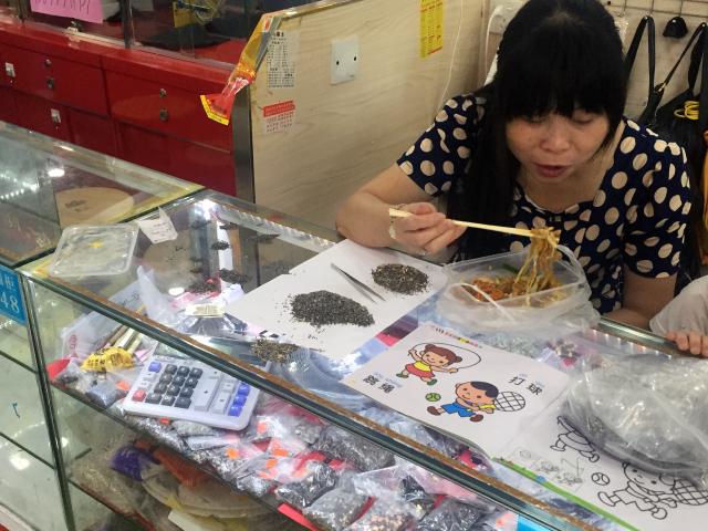 A vendor taking a break from sorting recycled SMD-components