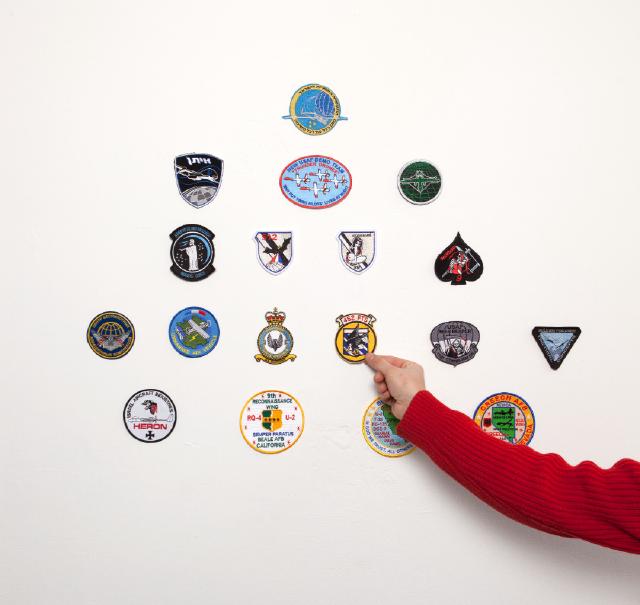A collection of uniform patches worn by military units operating drones. The patches have been purchased on-line.